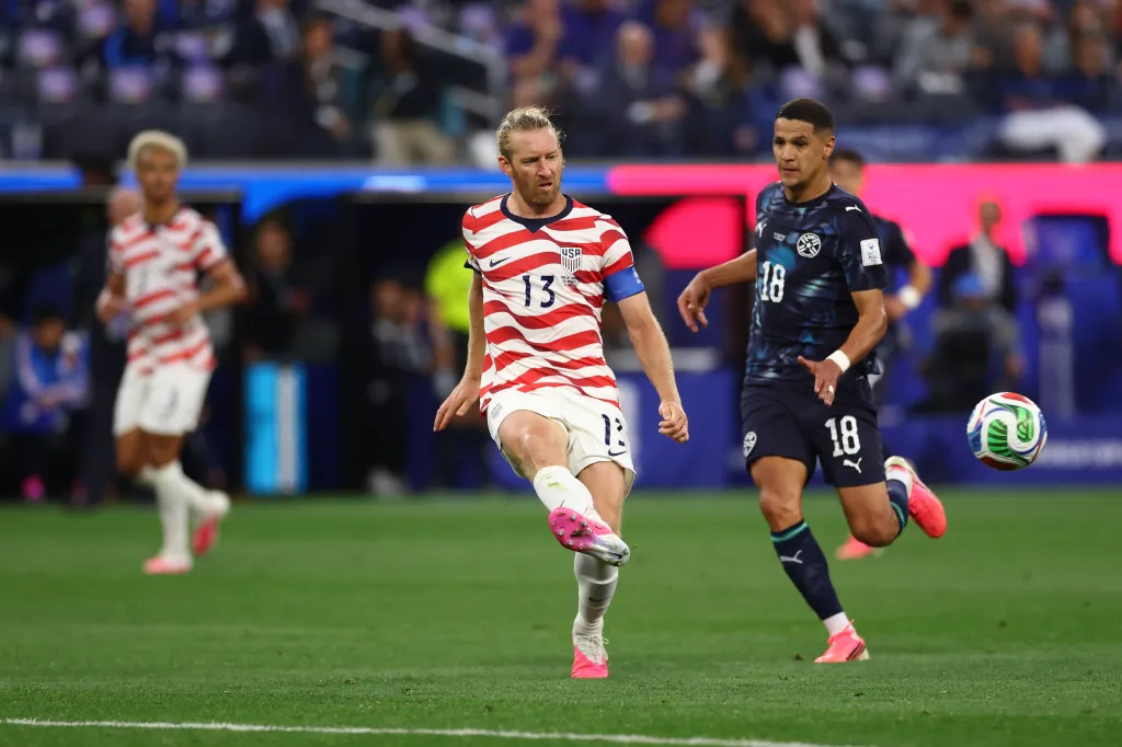 Tim Ream of the United States passes the ball whilst under pressure from Alex Arce of Paraguay during the FIFA World Cup 2026 Group D match between USA and Paraguay at Los Angeles Stadium on June 12, 2026 in Los Angeles, California.