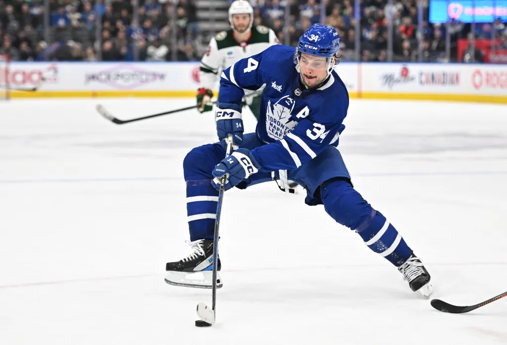 Toronto Maple Leafs forward Auston Matthews (34) skates with the puck against the Minnesota Wild.