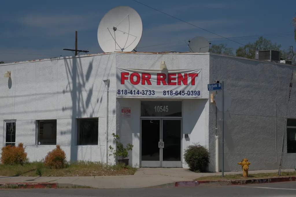 Exterior view of a building in North Hollywood with a "FOR RENT" banner.