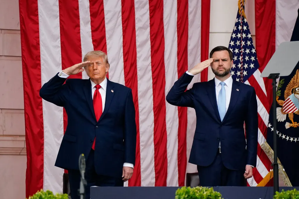U.S. President Donald Trump and U.S. Vice President JD Vance salute in the Memorial Amphitheater.