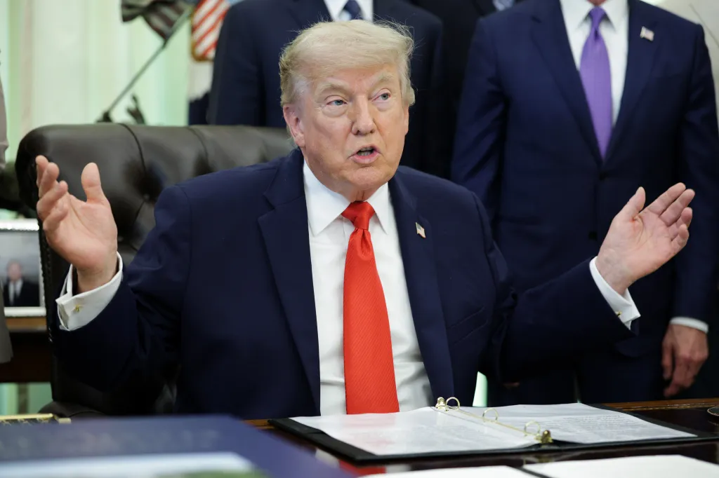 President Trump signing a proclamation in the Oval Office.