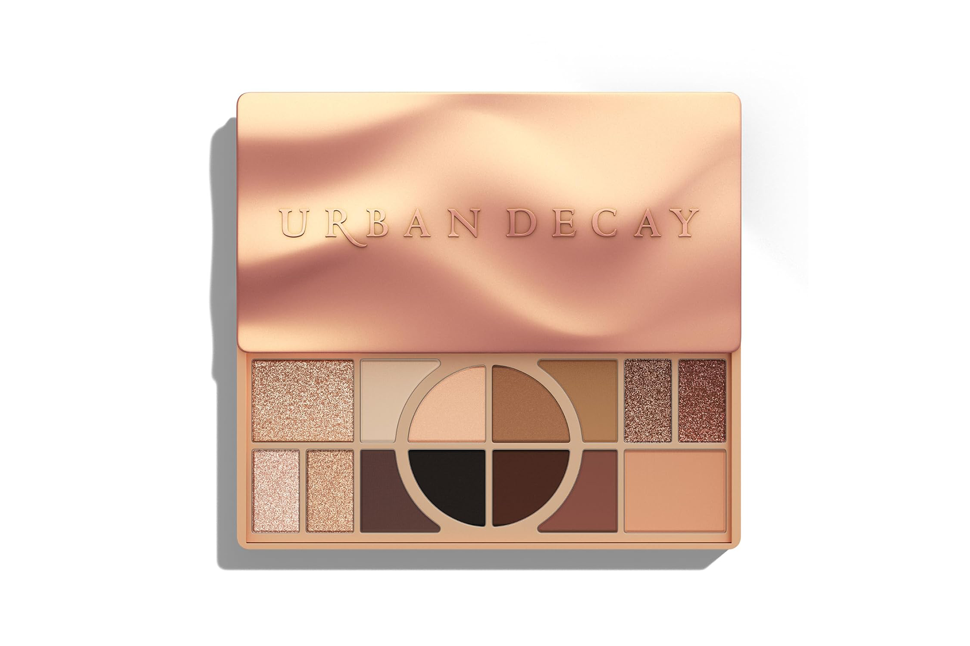 Urban Decay eyeshadow palette in various shades of brown and nude.