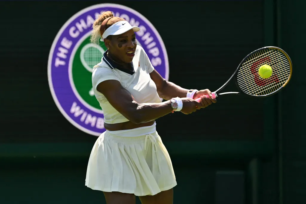 Serena Williams hitting a tennis ball during practice at Wimbledon.