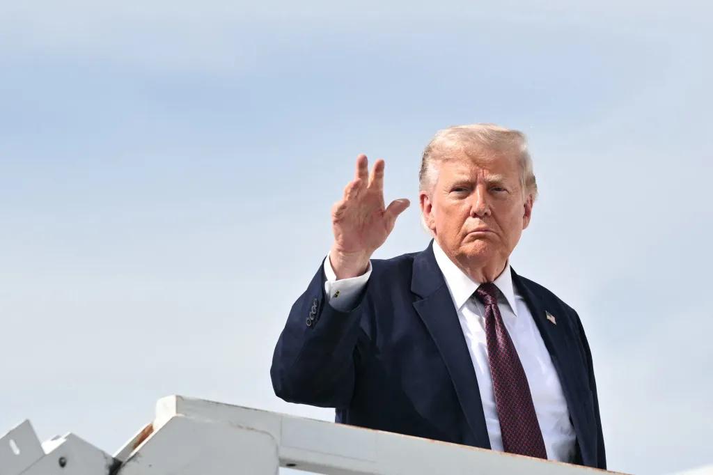 US President Donald Trump waves as he boards Air Force One.