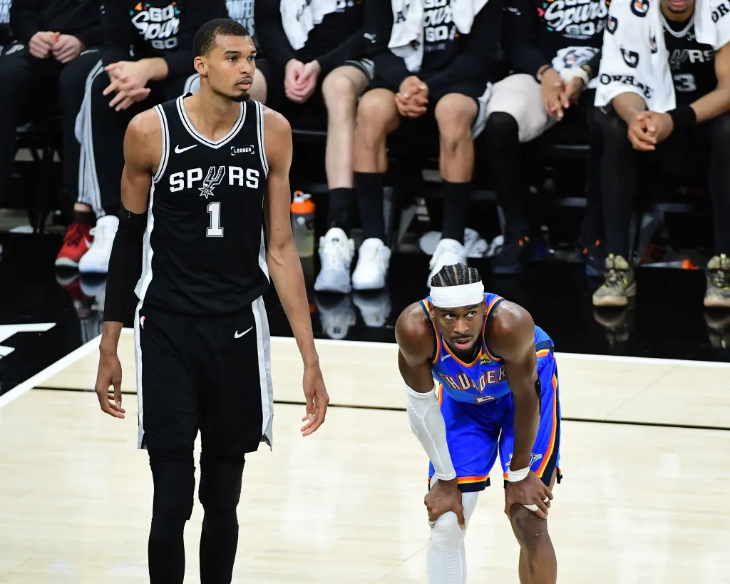 Victor Wembanyama of the San Antonio Spurs and Shai Gilgeous-Alexander of the Oklahoma City Thunder on the court.