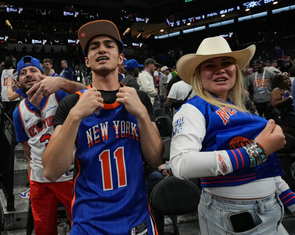 New York Knicks fans cheer at a 2026 NBA Finals game.