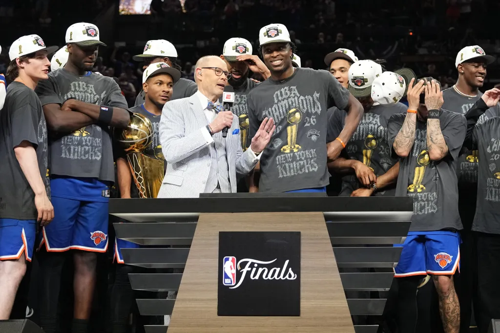 OG Anunoby and other New York Knicks players celebrate winning the NBA Finals.