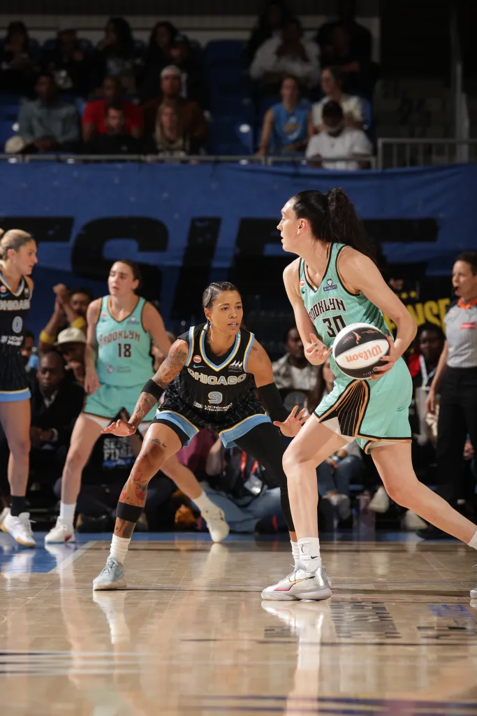 Natasha Cloud of the Chicago Sky playing defense against a New York Liberty player.