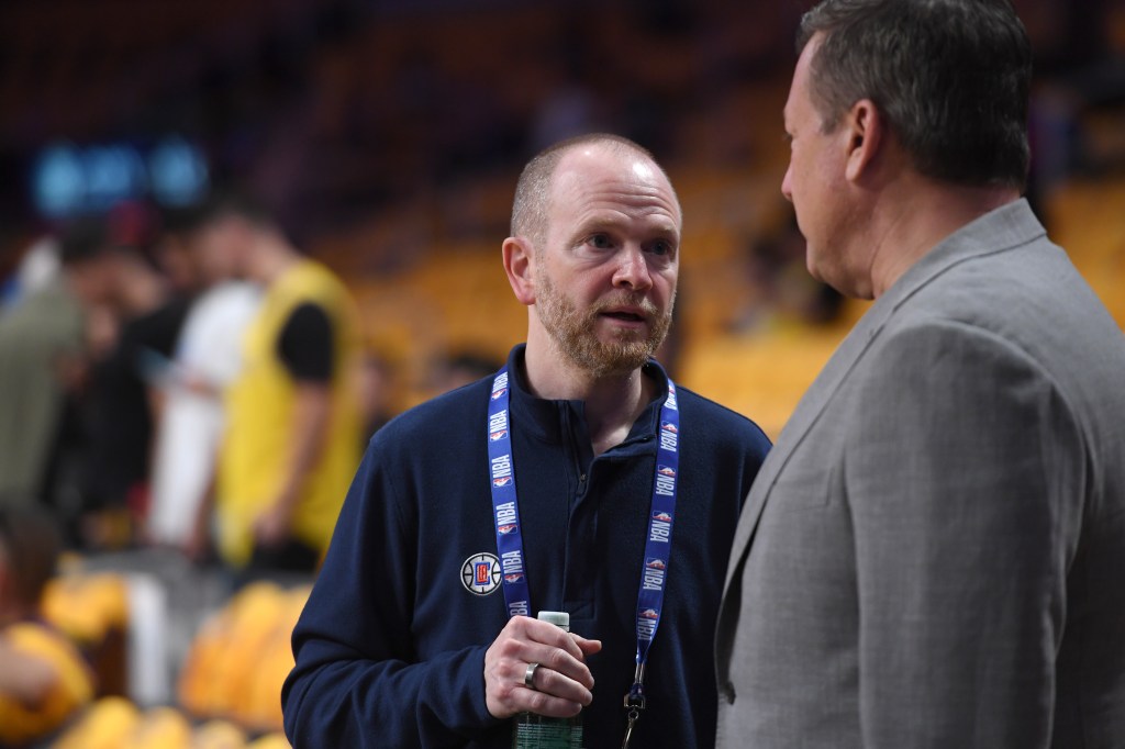 LA Clippers President Lawrence Frank speaks at a game.
