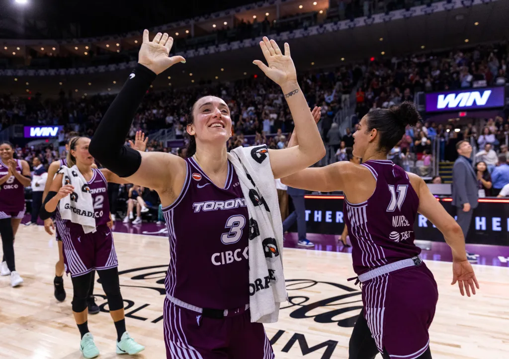 Toronto Tempo player Marina Mabrey celebrates with a teammate after scoring 53 points against the Los Angeles Sparks.