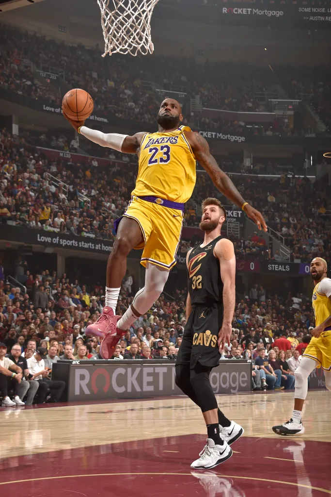 LeBron James of the Los Angeles Lakers dunks the ball against the Cleveland Cavaliers.