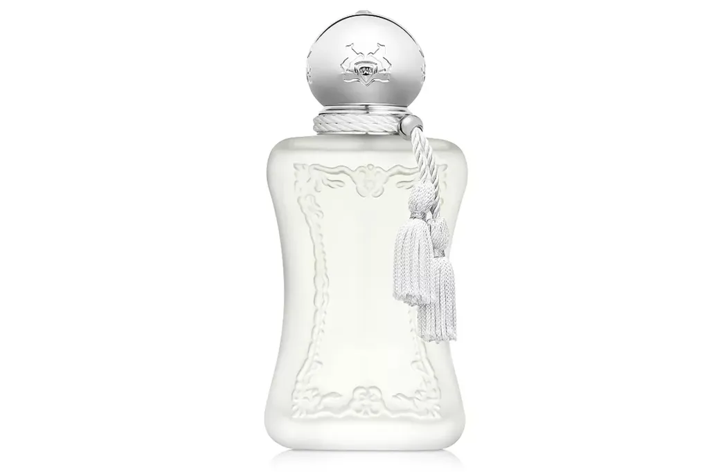 A decorative perfume bottle with a silver cap and white tassel.