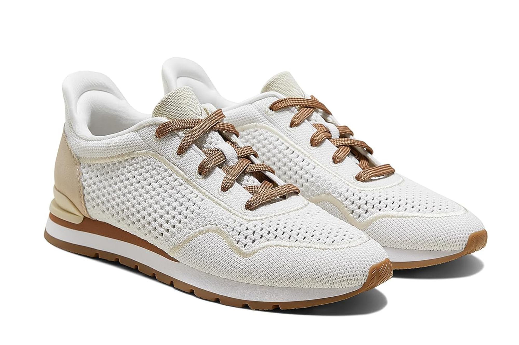 Pair of white knit sneakers with brown laces and soles.