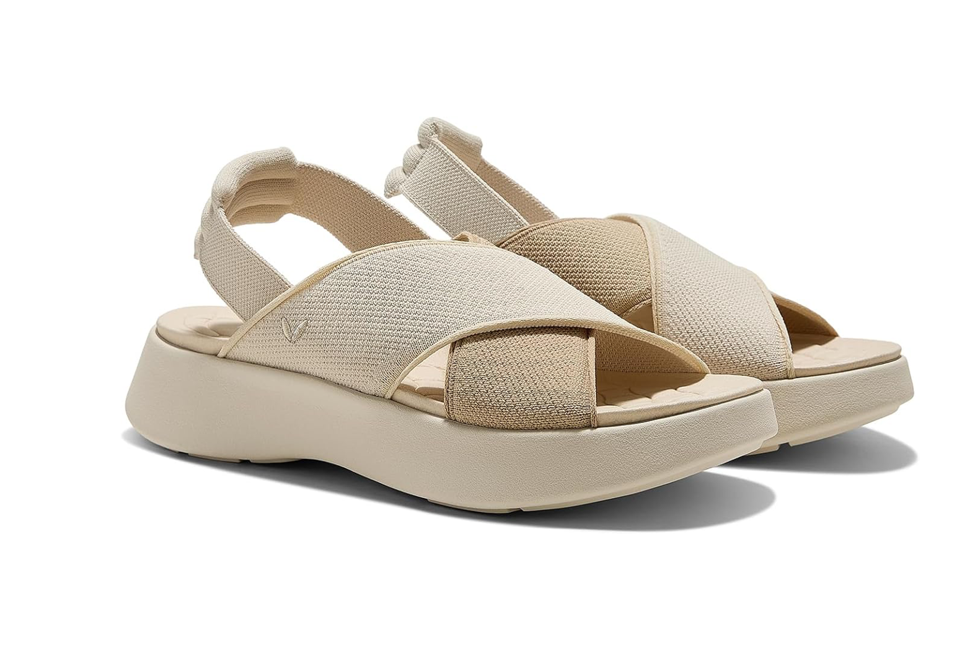 Pair of cream and beige criss-cross strap platform sandals.