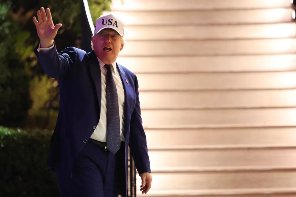 President Donald Trump waves while returning to The White House.
