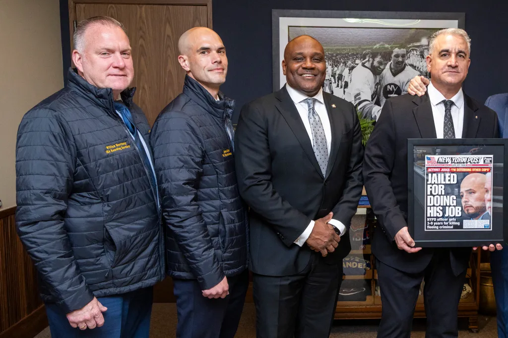 From l to r: William Morrissey, SBA Recording Secretary, John Collins, SBA City Secretary, Edmund Small, SBA Vice President, Vincent Vallelong, SBA President,  gather to raise money for NYPD Erik Duran in jail for throwing a cooler at a suspect and killing him at UBS Arena, Tuesday, April 14, 2026