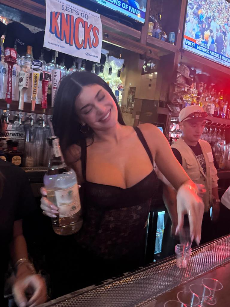 Kylie Jenner plays bartender and starts pouring drinks while in NYC for the Knicks parade.