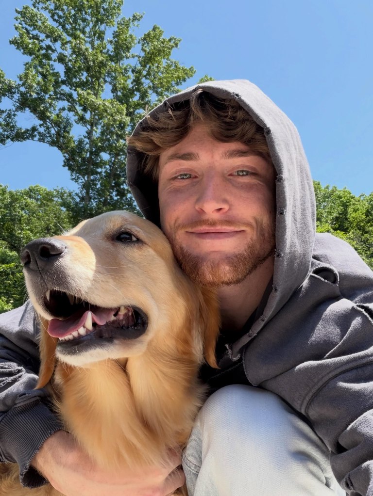 Bailey Zimmerman and his dog posing for a selfie.