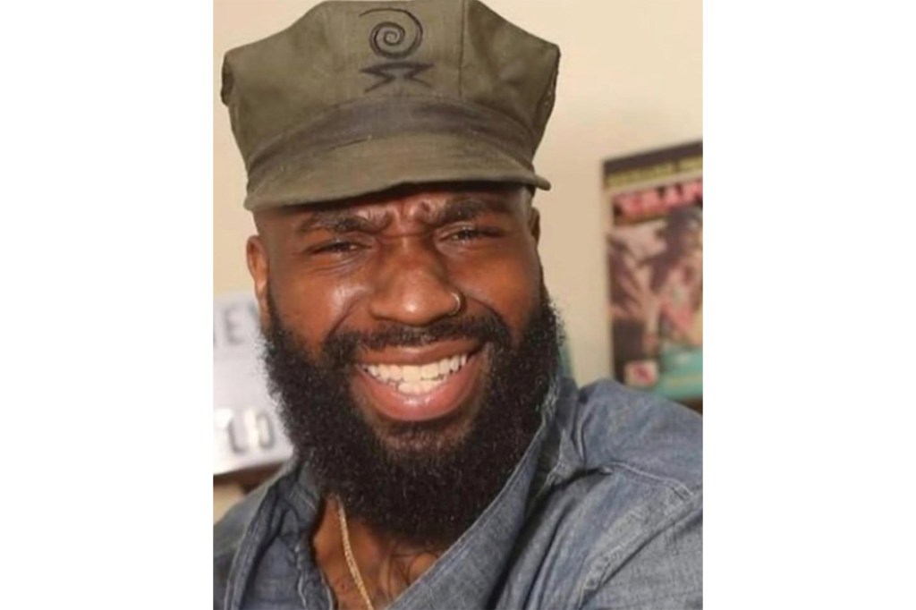 A photo of the victim smiling wearing a hat.