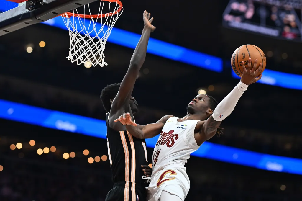 Keon Ellis #14 of the Cleveland Cavaliers goes to the basket as Mouhamed Gueye #18 of the Atlanta Hawks defends during the third quarter at State Farm Arena on April 10, 2026 in Atlanta, Georgia. NOTE