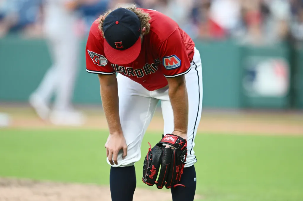 Cleveland Guardians pitcher Tanner Bibee (28) reacts after a run scored on an error by left fielder Cooper Ingle (not pictured) during the seventh inning against the Texas Rangers at Progressive Field.