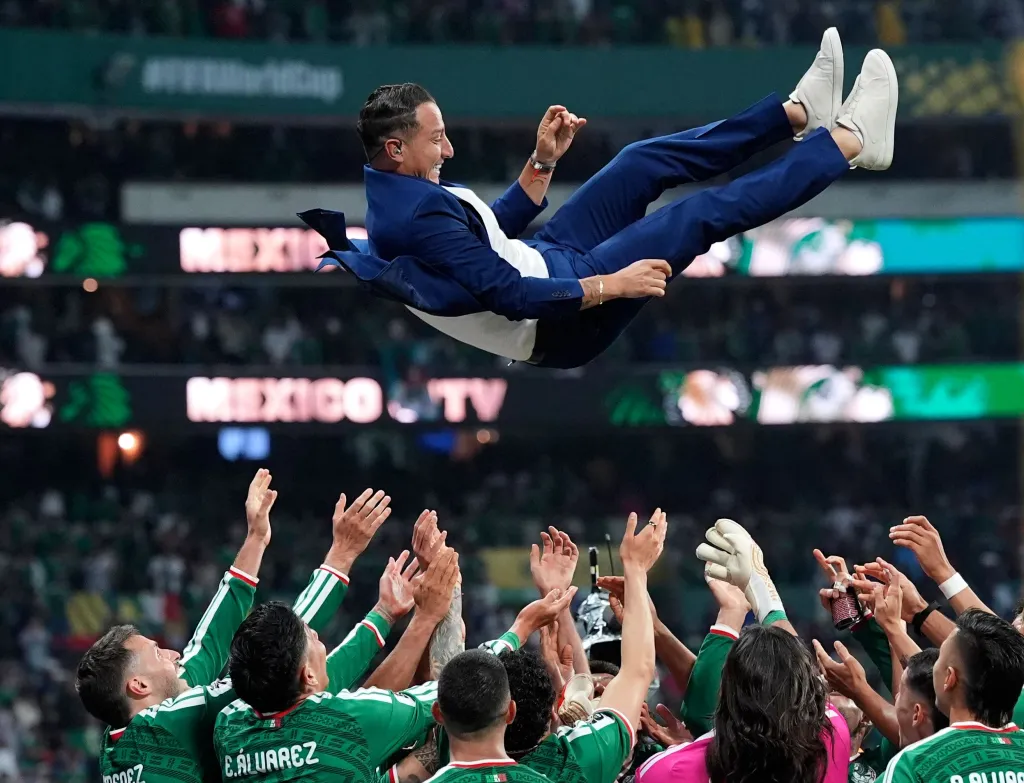 Mexico players toss  Carlos Salcido, a former El Tri player, in the air in celebration after their 2-0 win over Ecuador in their Round of 32 World Cup match on June 30, 2026 in Mexico City.