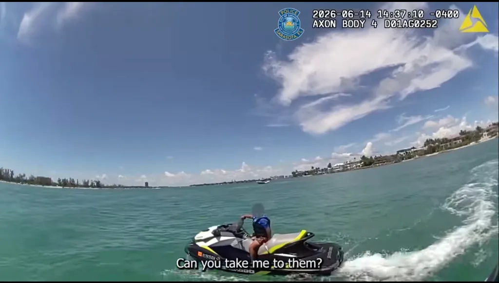 Bodycam footage from the Sarasota Police Department showing a person on a jet ski asking "Can you take me to them?"