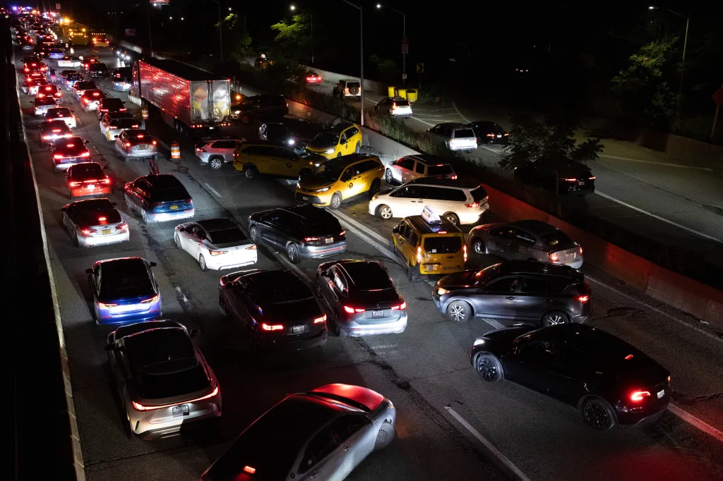 Cars turning around on the Long Island Expressway in Queens, New York, after a multi-fatal accident blocked the roadway.