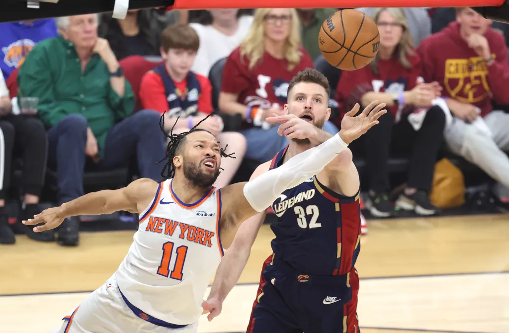 New York Knicks guard Jalen Brunson (11) shoots as Cleveland Cavaliers forward Dean Wade (32) defends during the first quarter.