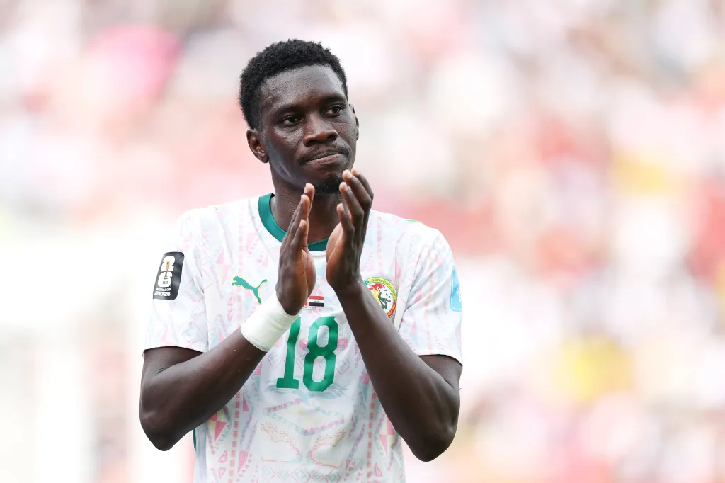 Ismaila Sarr of Senegal applauds fans during a FIFA World Cup 2026 match.