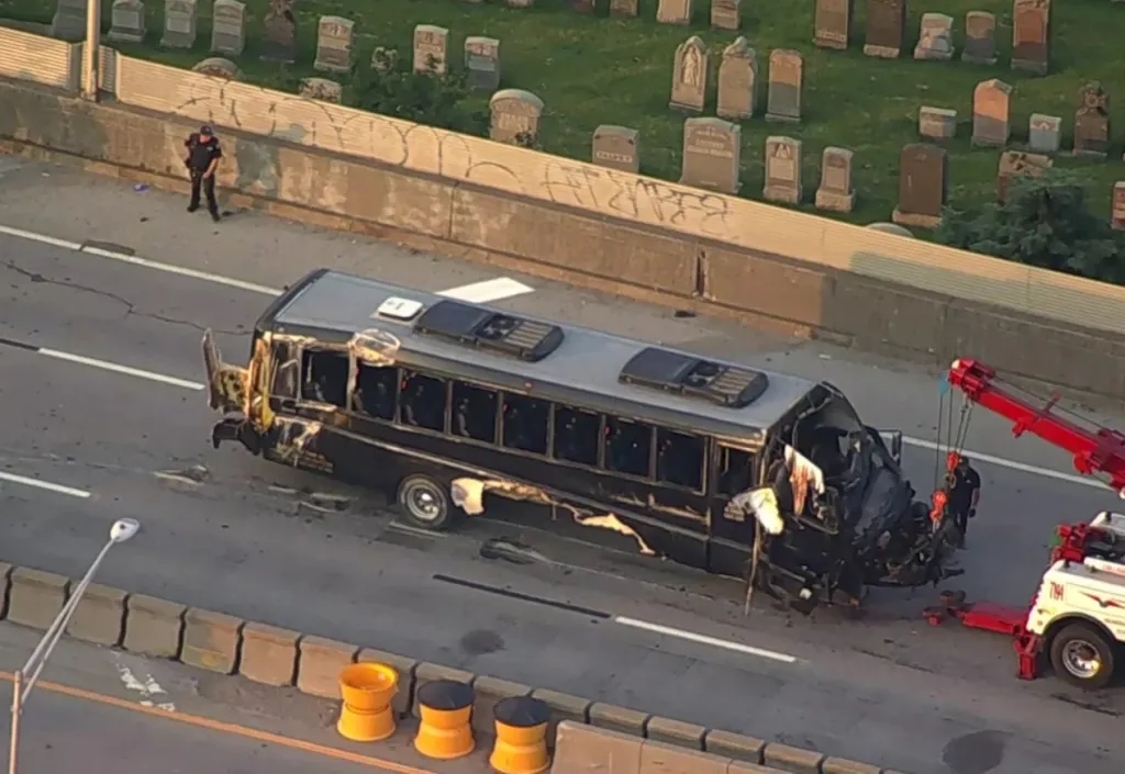 A bus involved in a crash being towed away from the Long Island Expressway.