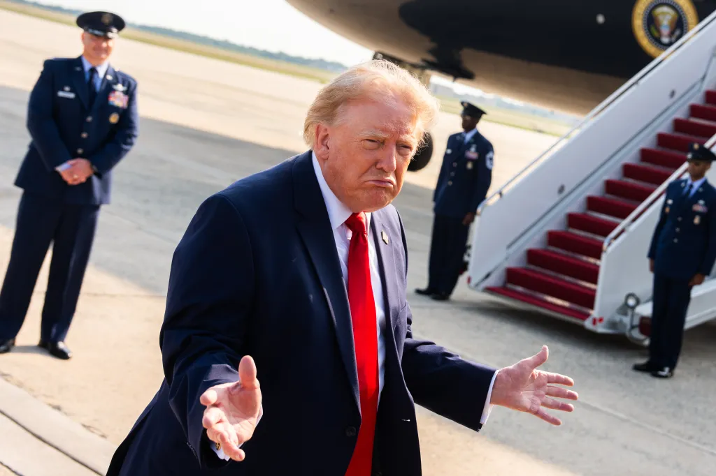 Donald Trump speaking with reporters before boarding Air Force One.