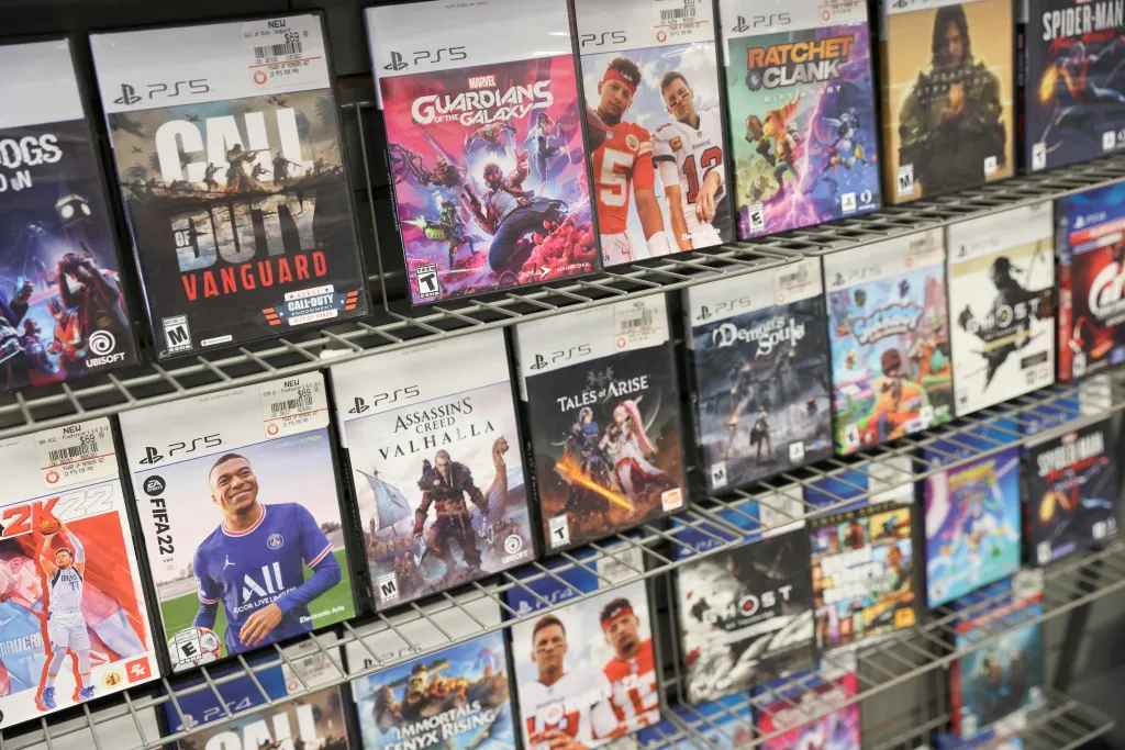 PS5 games, including Call of Duty: Vanguard, Guardians of the Galaxy, and FIFA 22, are displayed for sale in a GameStop store.
