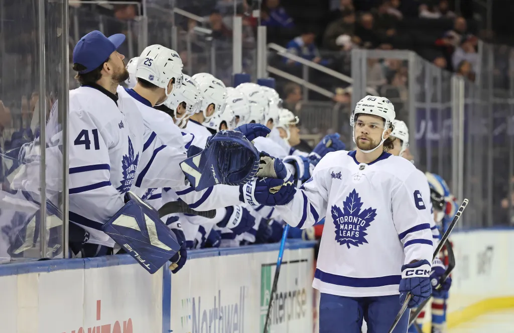 Toronto Maple Leafs left wing Matias MacCelli (63) is greeted by his teammates on the bench.