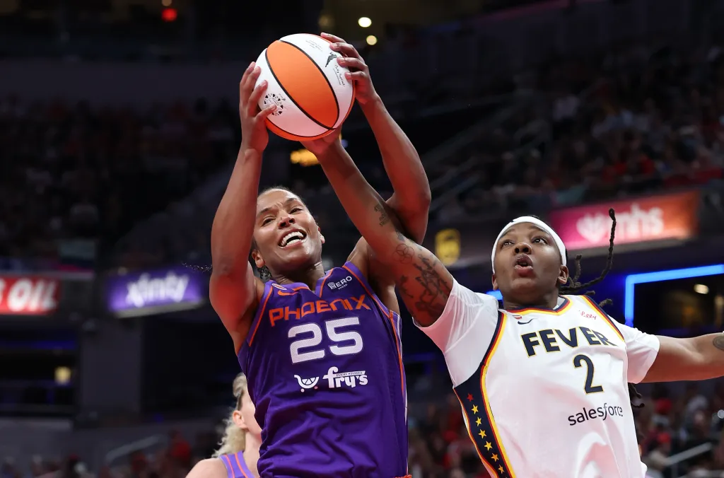 Phoenix Mercury player Alyssa Thomas (25) and Indiana Fever player Myisha Hines-Allen (2) reach for a rebound.